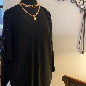 Roz and Ali black sweater